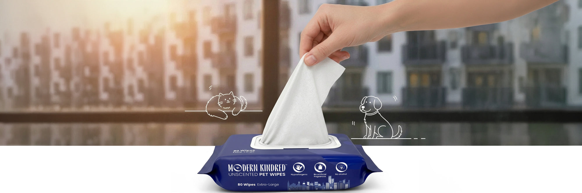 Hand pulling a Modern Kindred Unscented Pet Wipe from 80 count pack, extra large bamboo wipes for dogs and cats